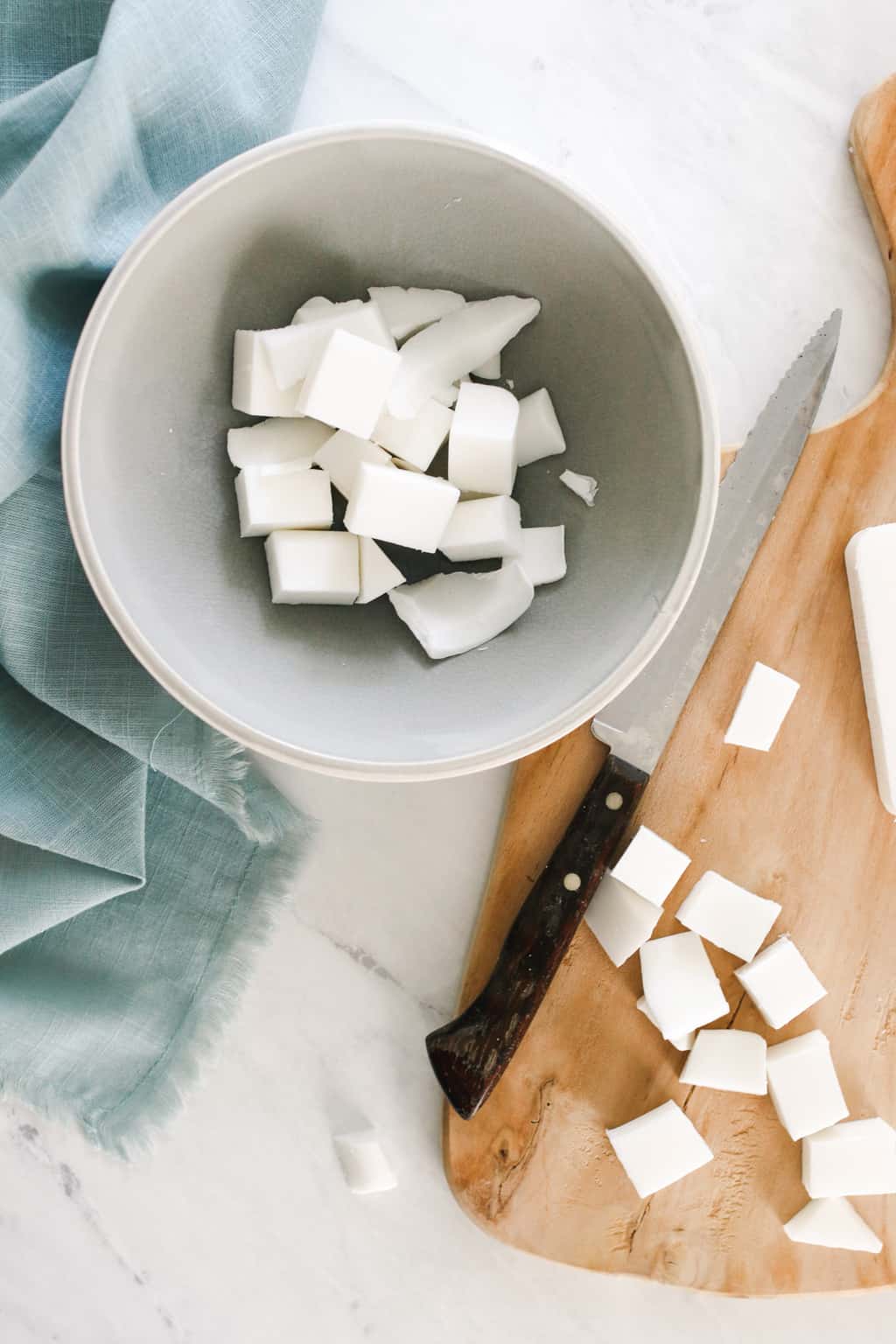 Chopping up melt and pour soap base for goat milk soap