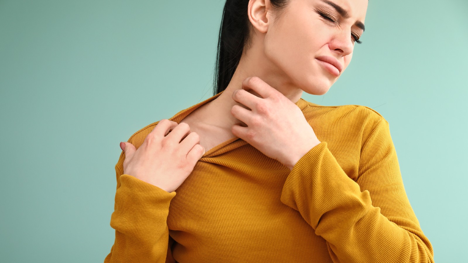 Woman with itchy skin in winter