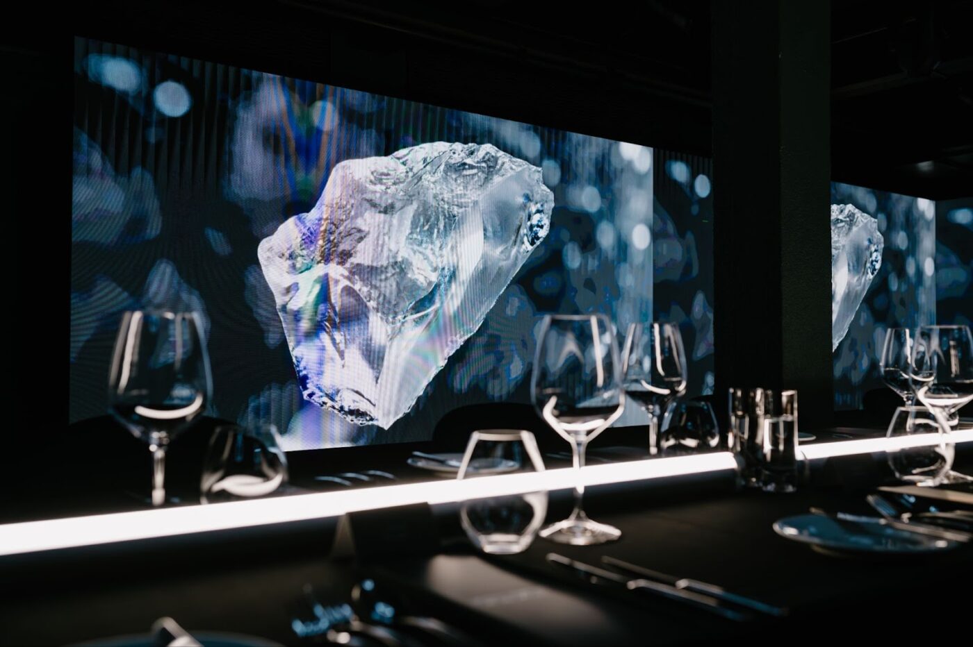 Modern dining with wine, screen.