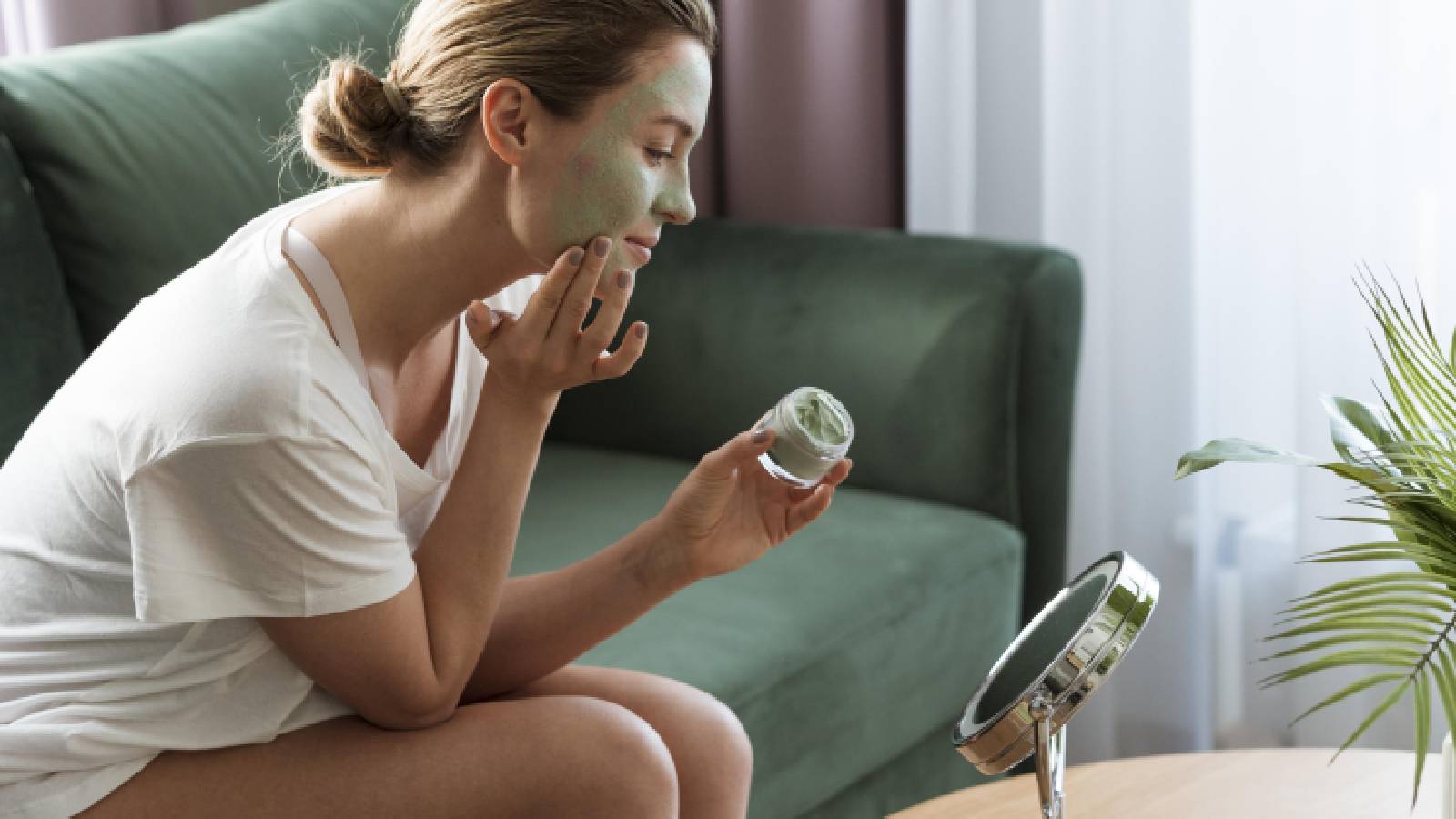 Woman applying a face mask