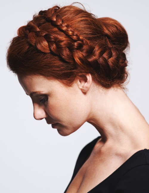 A woman with a braided crown with natural texture hairstyle